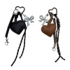 This black and brown heart-shaped keychain set is a fashionable and simple pendant suitable for both men and women Item Picture